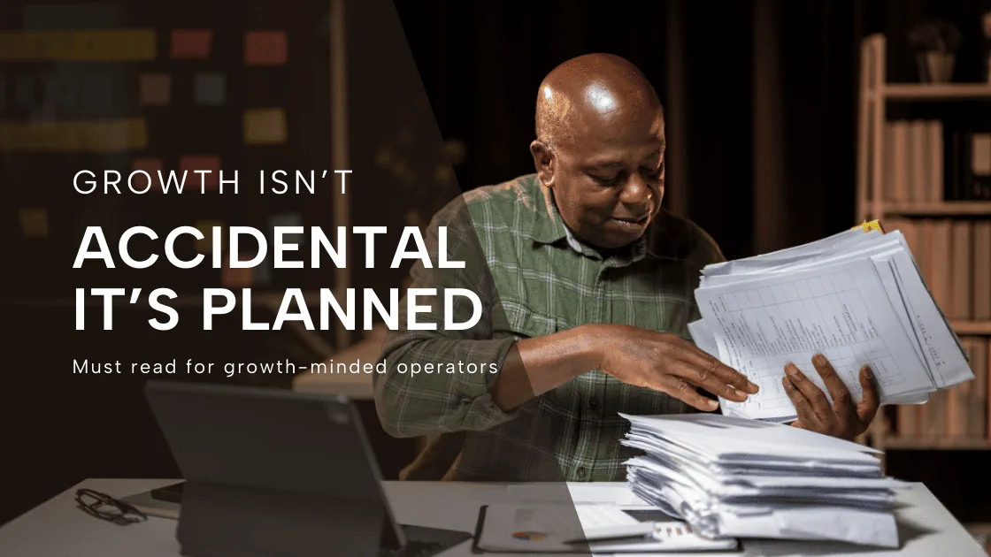 A man sorting through a stack of paperwork at a desk, titled Growth isn't accidental, it's planned