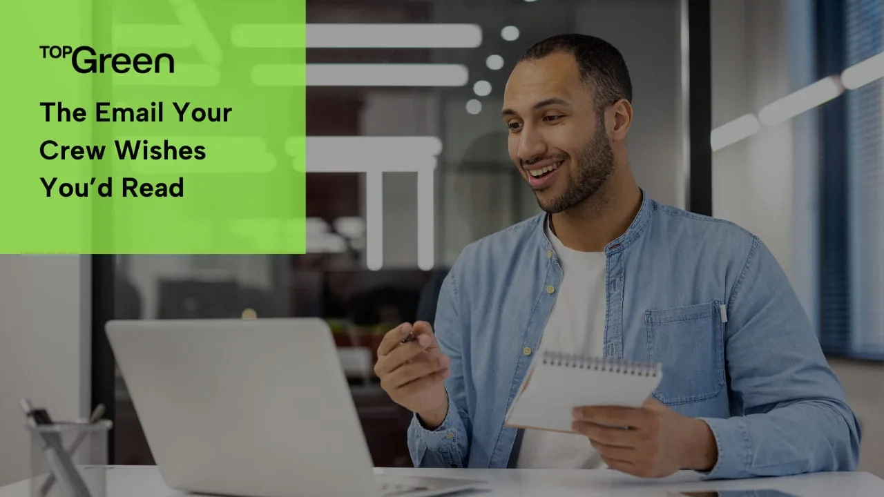 A man smiling at a laptop with a notebook in hand, titled The email your crew wishes you'd read